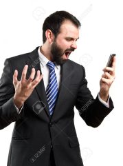 Young businessmen shouting to mobile over isolated background.